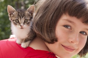 Little girl with cute kitten